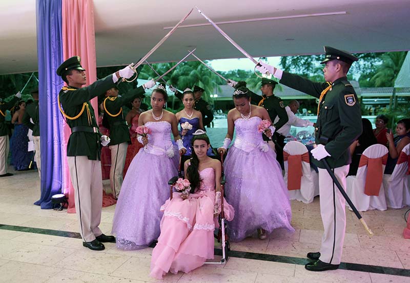 Female cancer patients take part in their "Quinceanera" (15th birthday) party at a hotel in Managua