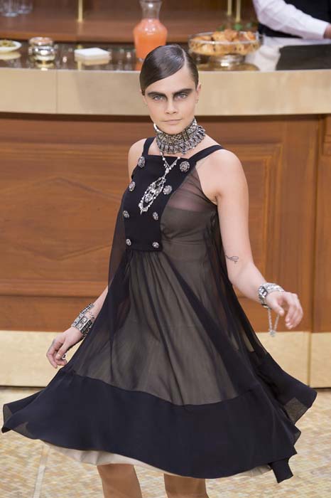 Model Cara Delevingne walks the runway during the Chanel show as