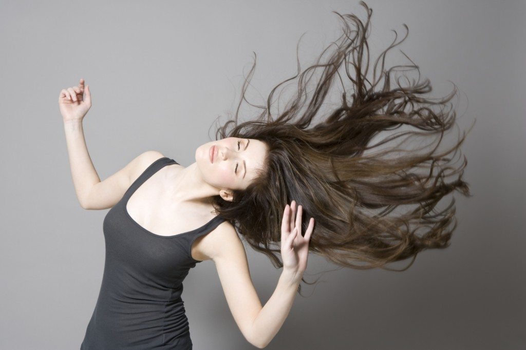 Woman with long brown hair, dancing