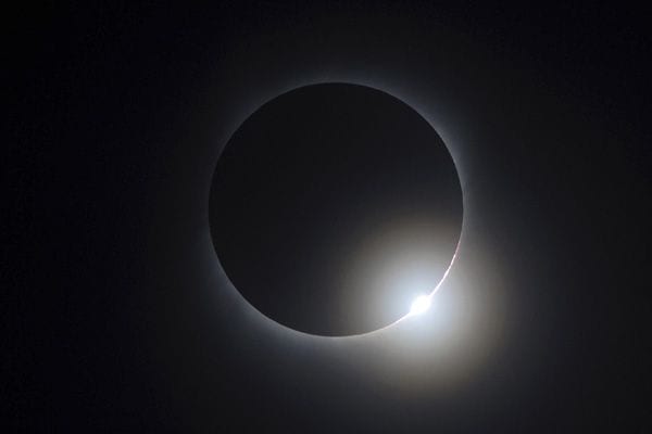 The moon passes between the sun and the earth during a solar eclipse as seen in Changsha, Hunan province July 22, 2009.  Source: REUTERS/Stringer