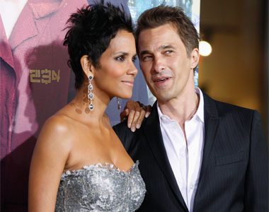 Actress Halle Berry, one of the stars of the new film "Cloud Atlas" poses as she arrives with her fiance French actor Olivier Martinez at the film's premiere at Grauman's Chinese theatre in Hollywood. REUTERS/Fred Prouser