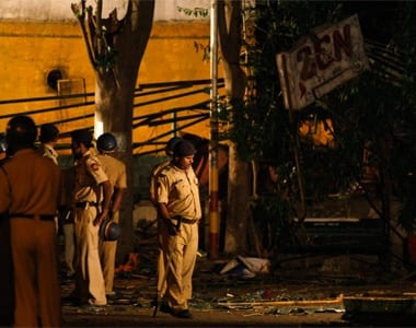 Police personnel examine the site of a bomb blast at the German Bakery restaurant in Pune.. REUTERS/Punit Paranjpe
