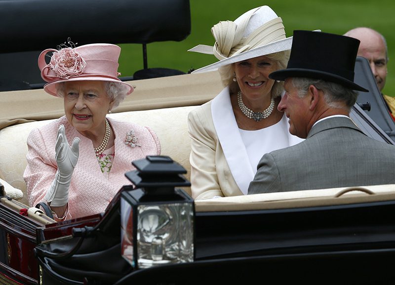 Britain's Queen Elizabeth (L), Prince Charles and Camilla Duchess of Cornwall arrive by carriage
