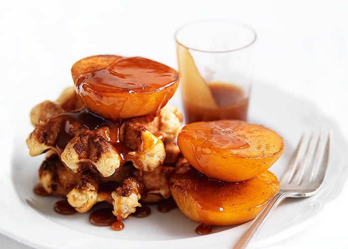Waffles with Roasted Peaches and Brandy Butter Sauce