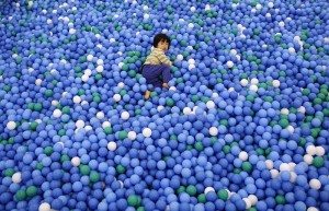 Two-year-old Nao Watanabe plays in a ball pit at an indoor playground which was built for children and parents who refrain from playing outside because of concerns about nuclear radiation in Koriyama