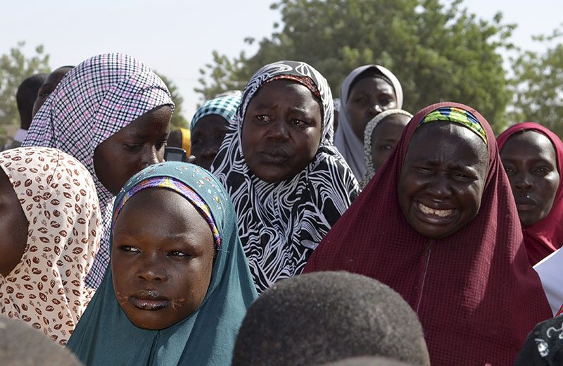 Mothers of kidnapped school girls react during a meeting with the Borno State governor in Chibok, Maiduguri, Borno State April 22, 2014. Parents of girls abducted by Islamist militants were searching for their daughters in a remote forest, they told the state governor on Monday. REUTERS/Stringer 