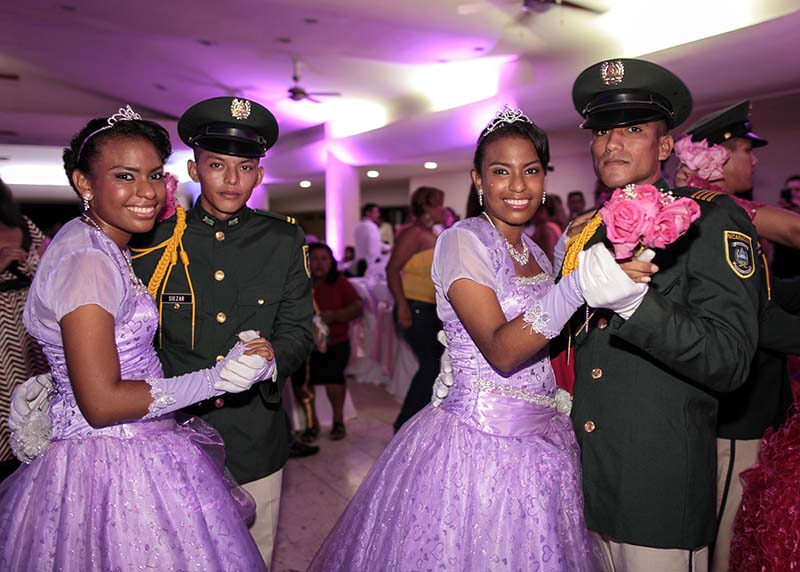 Twin cancer patients dance with cadets from Nicaragua's Military Academy during their "Quinceanera" (15th birthday) party at a hotel in Managua