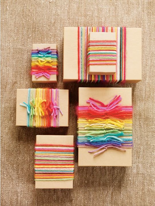 Coloured yarn makes for great (and affordable ribbon) to pair with simple brown paper. From erineverafter.blogspot.com