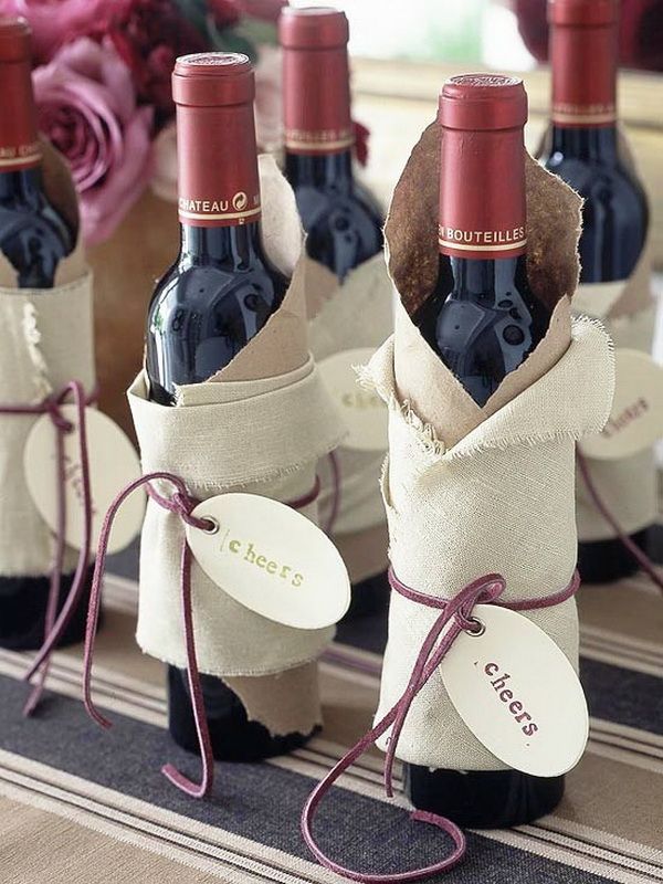 Loosely wrap wine and spirit bottles in cloth, a string and a gift tag for elegant simplicity. From stylisheve.com.