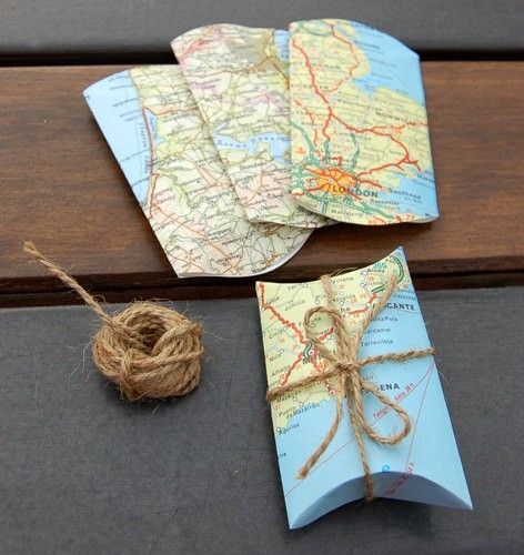 Flatten toilet paper rolls and cover in old maps. From indulgy.com