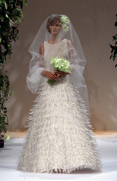 Feathered wedding gown for French fashion house Pierre Balmain by designer Oscar de la Renta for their 2001 Spring-Summer high fashion collection.