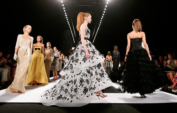 Models wear creations by Oscar De La Renta at a New York Fashion Week show September 12, 2005. 