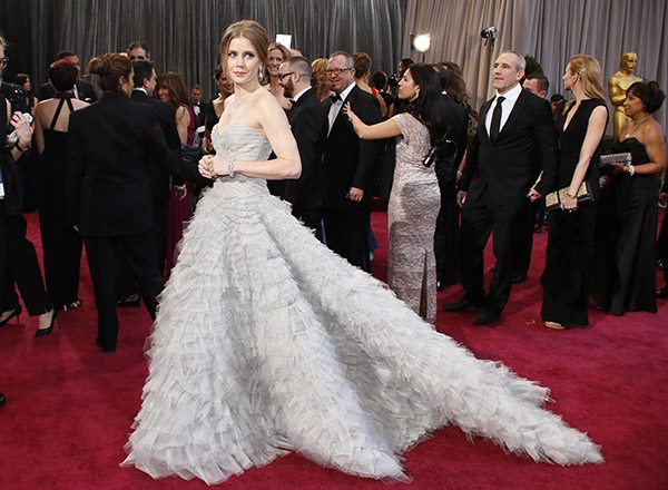 Amy Adams, best supporting actress nominee for her role in "The Master," arrives in her Oscar de La Renta gown at the 85th Academy Awards in Hollywood, 2013. 