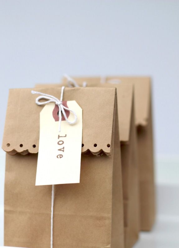 There's no denying the power of a brown paper bag when adorned with a clean, white gift tag. From thepartystudio.wordpress.com