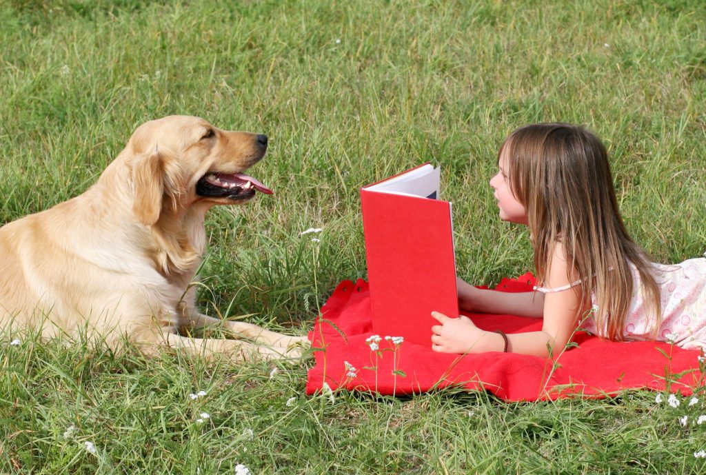 Therapy dogs help teach school children the benefit of reading