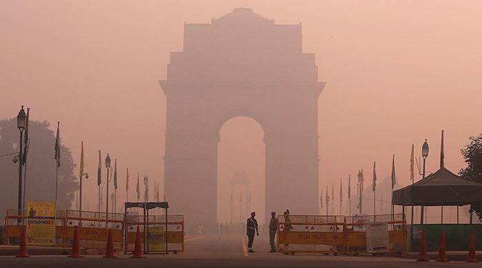 The India Gate, Delhi, can barely be seen through heavy smog