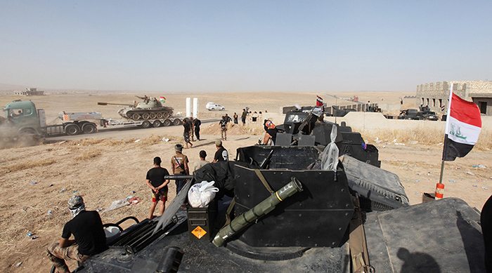 Iraqi security forces and Kurdish Peshmerga forces gather on the east of Mosul during preparations to attack.