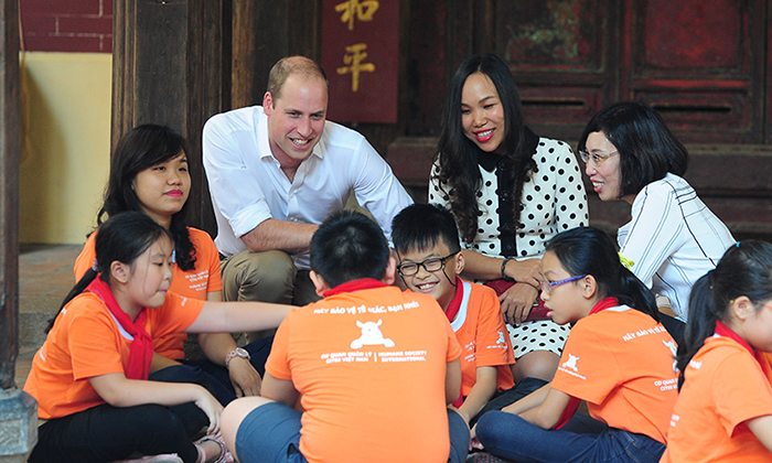 William talks with schoolchildren in Hanoi today, after launching a book designed to educate about endangered rhinos.