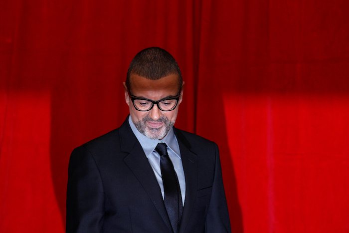FILE PHOTO British singer George Michael poses for photographers before a news conference at the Royal Opera House in central London May 11, 2011.   REUTERS/Stefan Wermuth