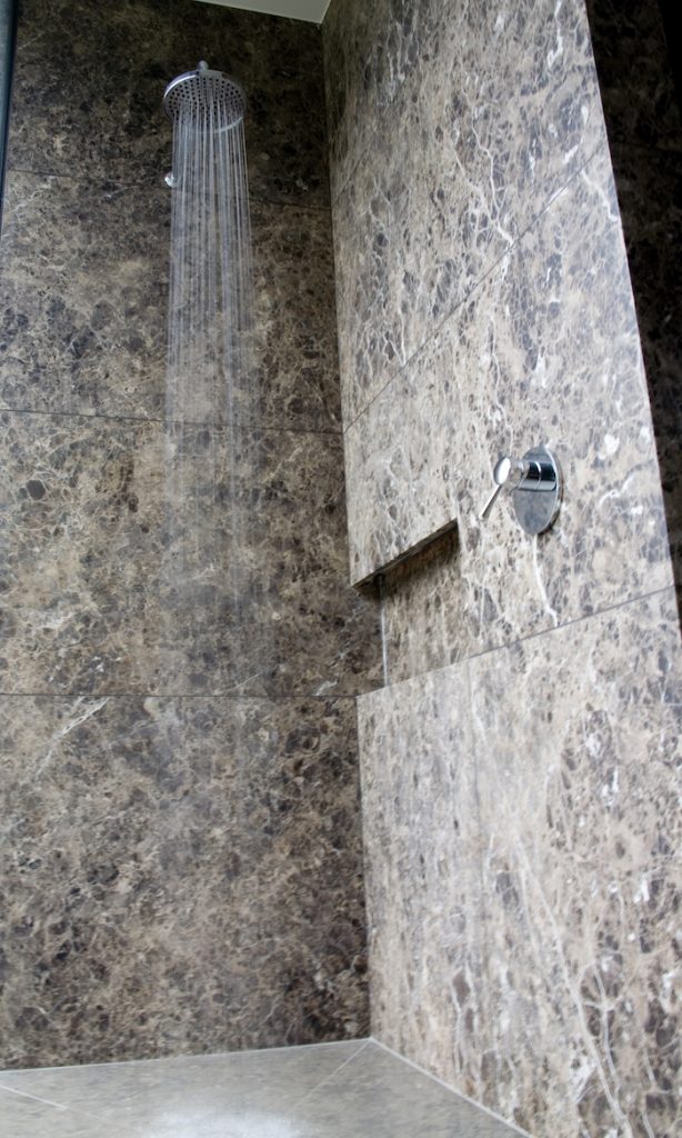 Guest bathroom also using honed brown emperador marble