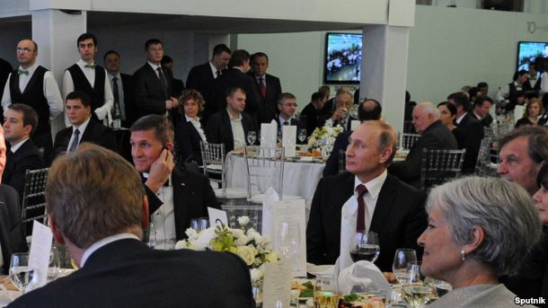 Michael Flynn sits next to Vladimir Putin at a dinner in Moscow in December 2015 - a move which reportedly 'startled' US officials