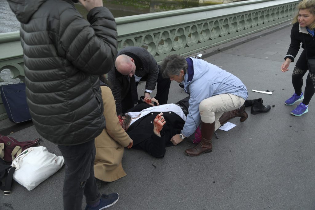 Injured people are assisted after the incident on Westminster Bridge. Picture Reuters