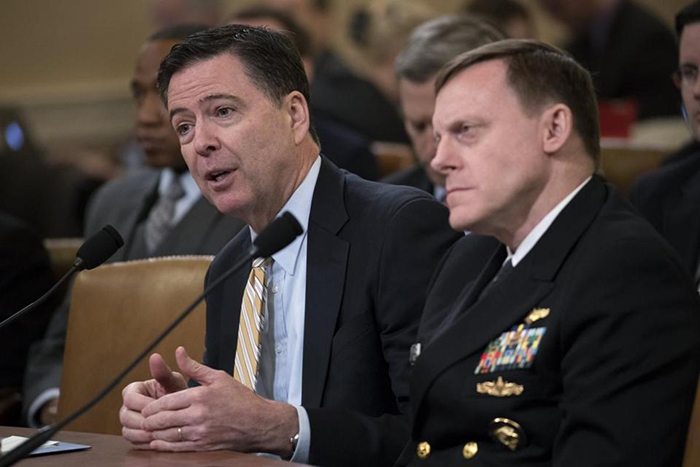 An extraordinary moment in US history - James Comey (left) and Michael Rogers testify before the House intelligence committee