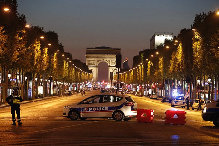 Police secure the Champs Elysees after a police officer was killed and two others wounded in the shooting incident in Paris. Photo: Reuters