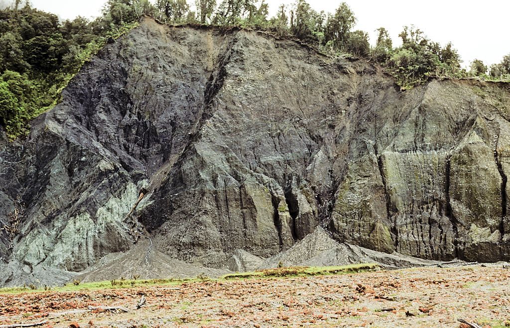 Famous Alpine Fault over thrust at Gaunt Creek, Slip face, Green Cataclasite is base of over thrust which has moved from left to right, North of HaaSt West CoaSt New Zealand. (Photo by Education Images/UIG via Getty Images)
