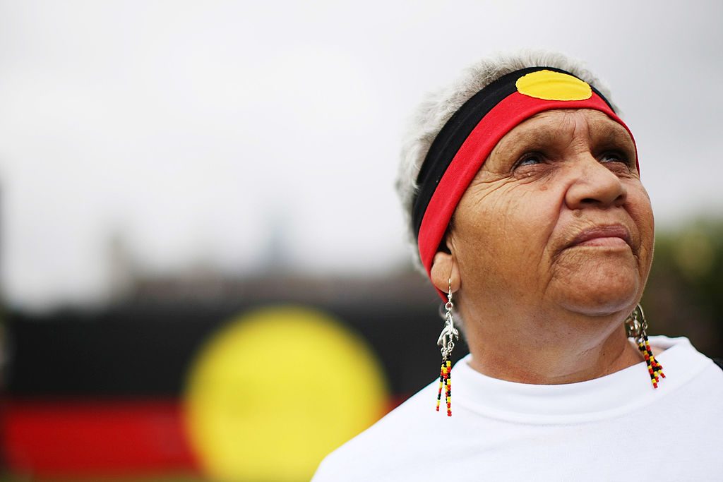 SYDNEY, AUSTRALIA - FEBRUARY 13:  Indigenous Australian Joan Baker, daughter of Ruby Williams who was taken from her family at three years of age, looks on after watching the live televsion broadcast from Australian Parliament in Canberra where Australian Prime Minister Kevin Rudd delivered an apology to the Aboriginal people for injustices committed over two centuries of white settlement on February 13, 2008 in Sydney, Australia. Rudd's apology referred to the "past mistreatment" of all Aborigines, singling out the "Stolen Generations", the tens of thousands of Aboriginal children taken from their families by governments between 1910 and the early 1970s, in a bid to assimilate them into white society.  (Photo by Kristian Dowling/Getty Images)