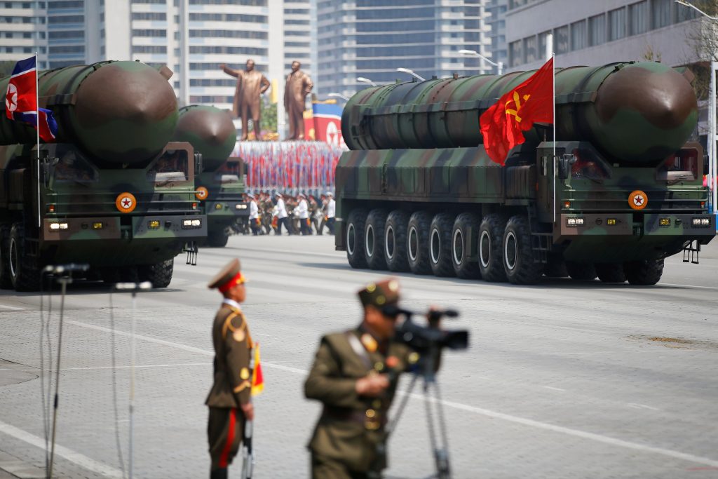 Intercontinental ballistic missiles (ICBM) are driven past the stand with North Korean leader Kim Jong Un and other high ranking officials during a military parade marking the 105th birth anniversary of country's founding father Kim Il Sung, in Pyongyang April 15, 2017. The missiles themselves were shown for the first time inside a new kind of canister-based launcher on Saturday. The trucks upon which they are mounted are originally designed to move lumber. REUTERS/Damir Sagolj 