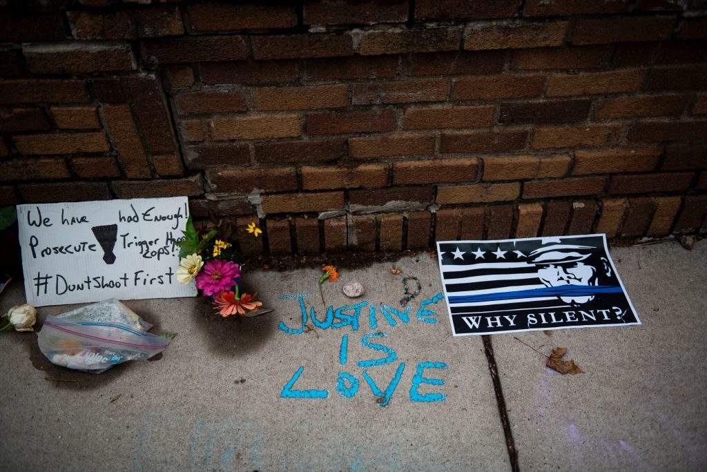 "Justine is Love" is written on the sidewalk at a makeshift memorial for Justine Damond on July 18, 2017 in Minneapolis, Minnesota. 
STEPHEN MATUREN/AFP/Getty Images