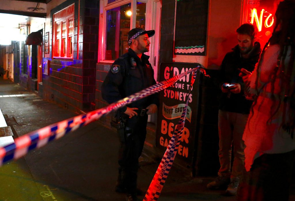 A policeman refuses to let members of the public walk onto a street that has been blocked to the public after Australian counter-terrorism police arrested four people in raids late on Saturday across several Sydney suburbs in Australia, July 29, 2017.      REUTERS/David Gray 