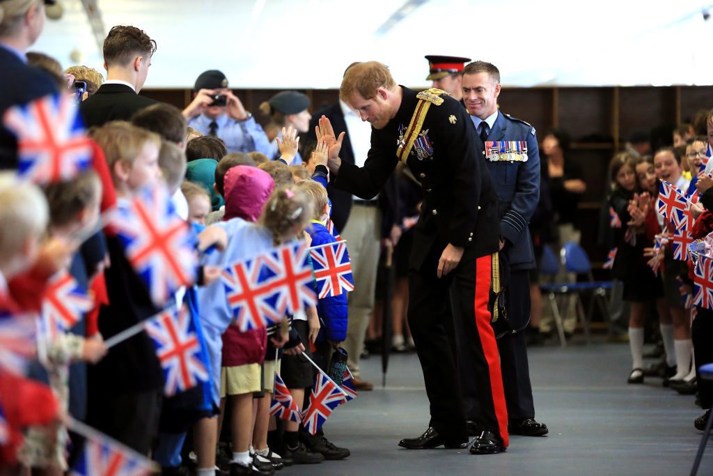 Prince Harry Greets Children As He Presents New Colour To RAF Regimen
