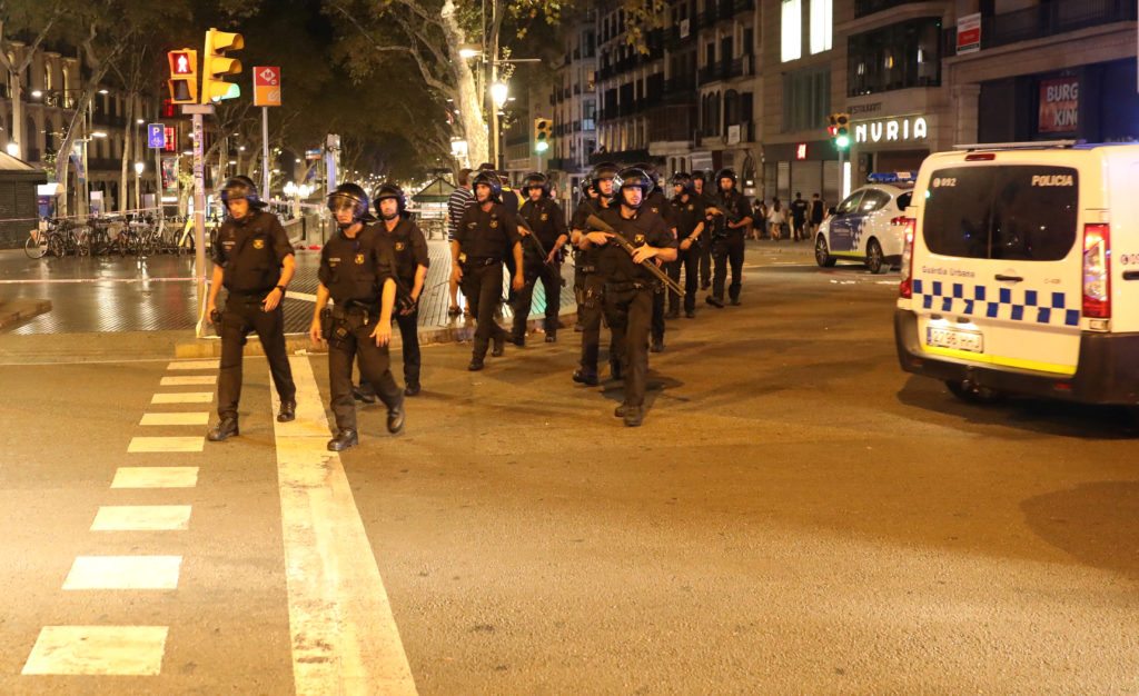 Armed Catalonian Mosses de Escuadra officers leave the area where a van crashed into pedestrians at Las Ramblas in Barcelona, Spain, August 18, 2017. REUTERS/Sergio Perez 