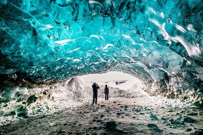The emerald blue ice and ash in the Crystal Cave on  Breidamerkurjokull  Glacier