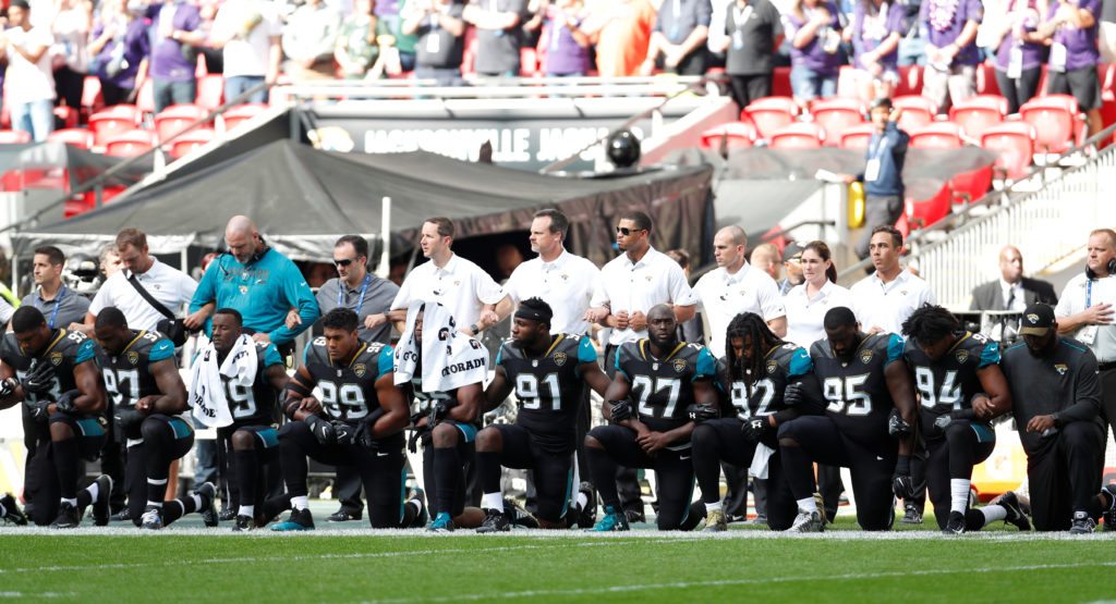 Players from the Jacksonville Jaguars kneel during the U.S. national anthem, September 24 2017.