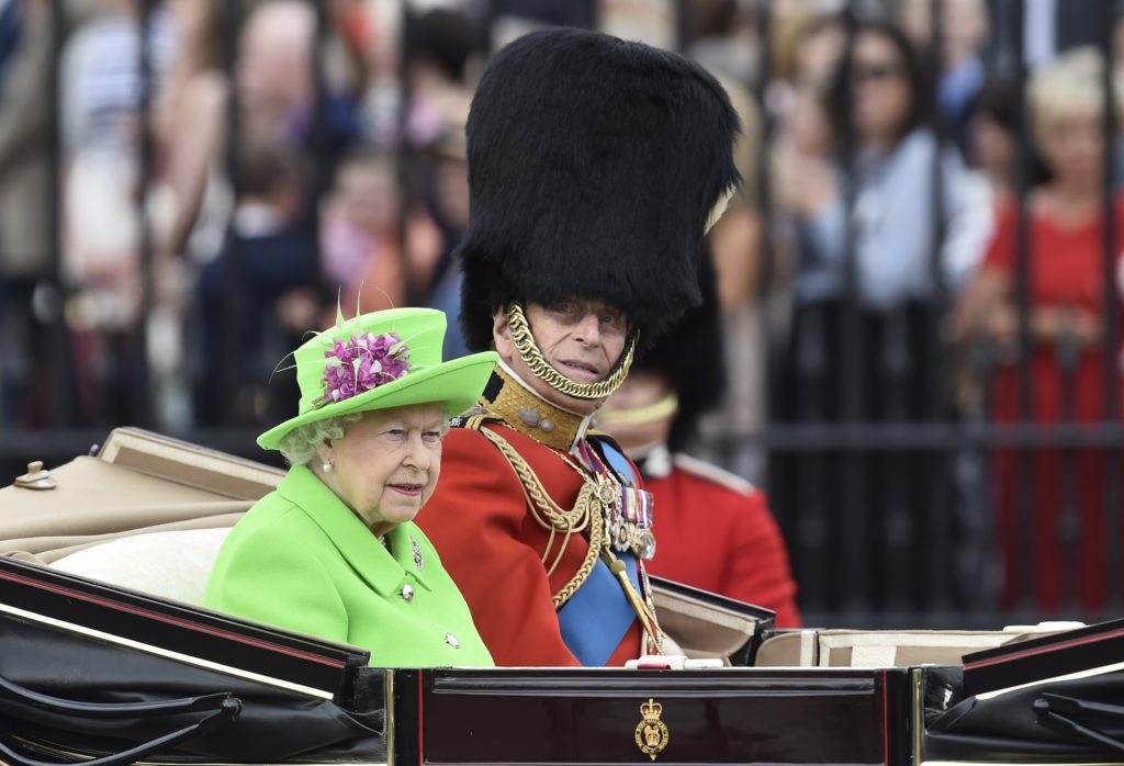 Queen Elizabeth II and Prince Philip travel in a carriage to Horseguards Parade for the annual Trooping the Colour ceremony in central London, Britain June 11, 2016. 