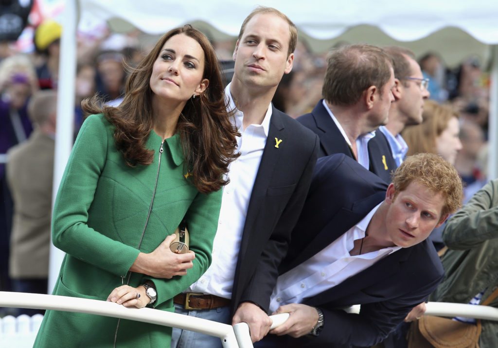 The Duchess of Cambridge, Prince William and Prince Harry watch the Tour de France, July 5, 2014. 