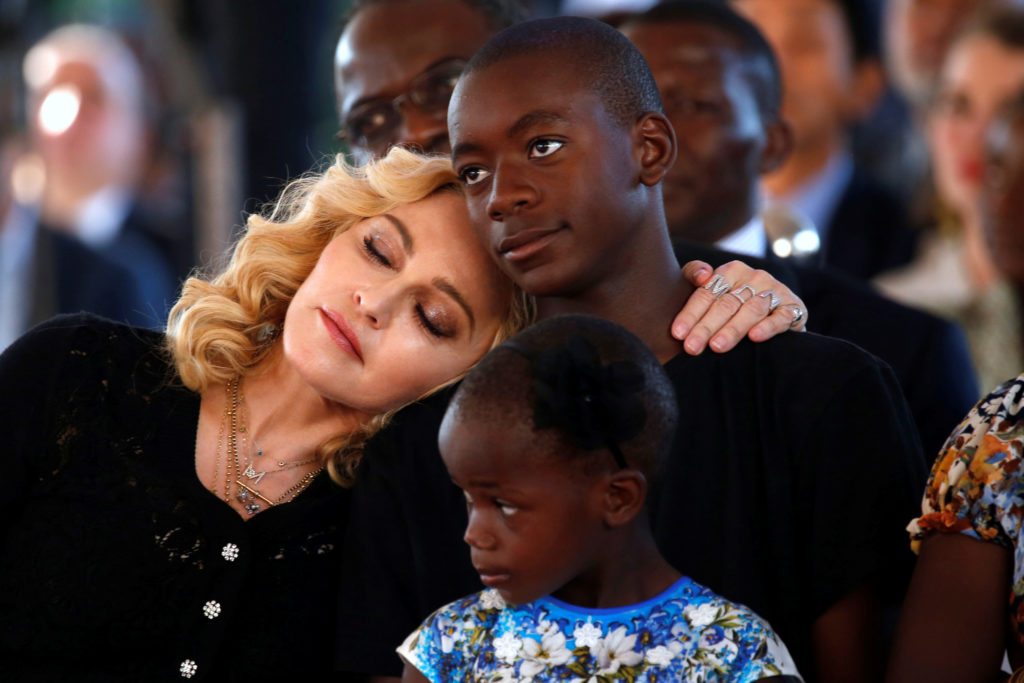US singer Madonna embraces her son, David Banda ahead of the opening of the Mercy James hospital in Blantyre, Malawi, July 11,2017. 