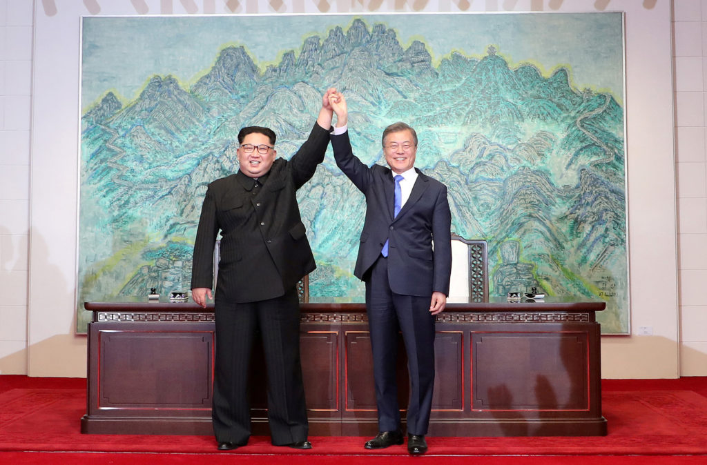 South Korean President Moon Jae-in and North Korean leader Kim Jong Un. Pool via Reuters     