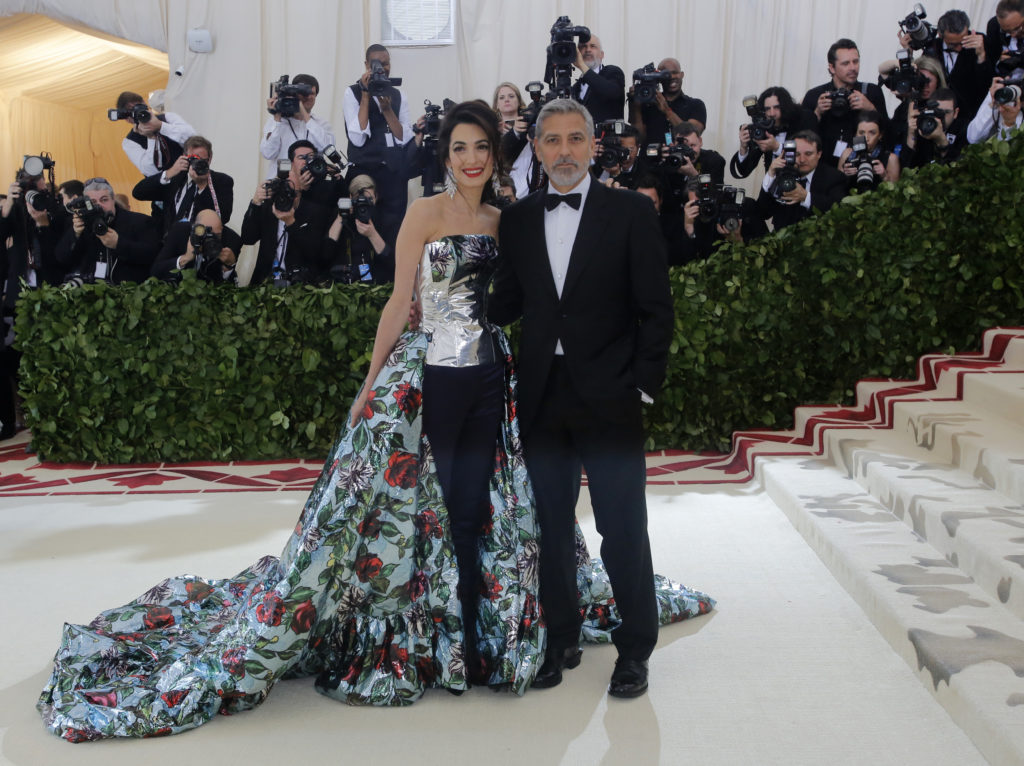 George and Amal Clooney arrive at the Met Gala. Amal wears a Richard Quinn. REUTERS/Eduardo Munoz 