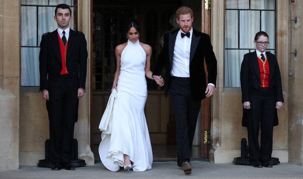 The newly married Duke and Duchess of Sussex, Meghan Markle and Prince Harry, leaving Windsor Castle after their wedding to attend an evening reception at Frogmore House, hosted by the Prince of Wales Windsor - Steve Parsons/Pool via REUTERS