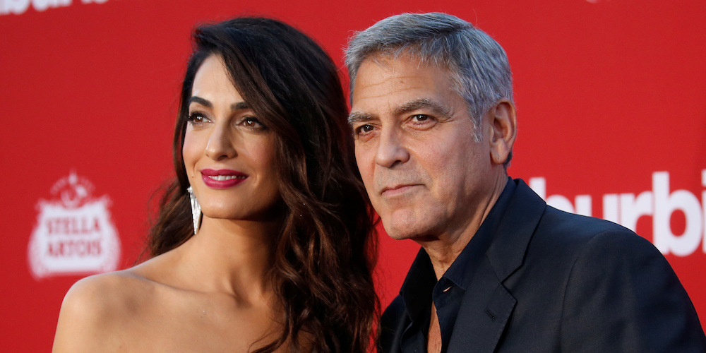 Director George Clooney and his wife Amal attend the premiere for "Suburbicon" in Los Angeles, California, U.S., October 22, 2017. REUTERS/Mario Anzuoni