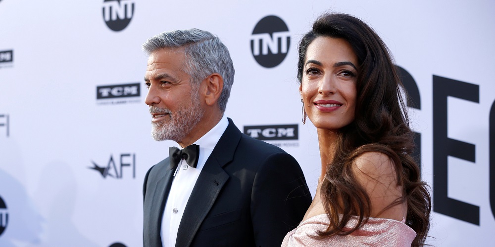 Actor George Clooney and his wife Amal pose at the 46th AFI Life Achievement Award Gala in Los Angeles, California, U.S., June 7, 2018. REUTERS/Mario Anzuoni