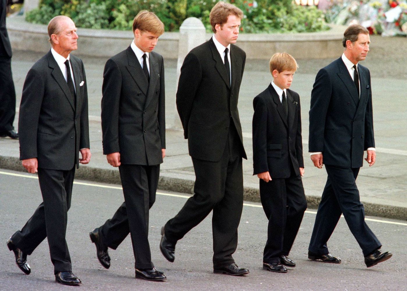 (L to R) The Duke of Edinburgh, Prince William, Earl Spencer, Prince Harry and Prince Charles walk outside Westminster Abbey during the funeral service for Diana, Princess of Wales, 06 September. Hundreds of thousands of mourners lined the streets of Central London to watch the funeral procession. (JEFF J. MITCHELL/AFP/Getty Images)