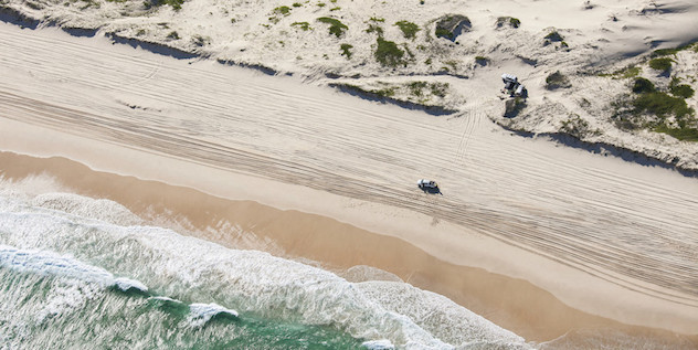 4WD driving along the beach on Worimi Conservation Lands, Port Stephens. Photo credit: Destination NSW