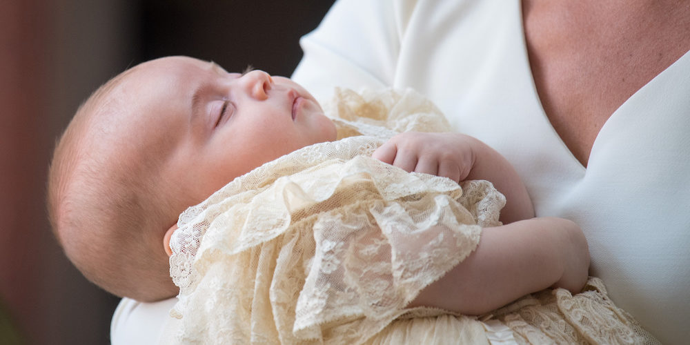 Prince Louis slept snuggly in his mother's arms, a picture of peace the traditional handmade replica of the Royal Christening gown.
The 1841 original was created by Jane Sutherland and was made of Spitalfields silk and Honiton lace. It was worn by 62 royal babies before it became too fragile to use.
The new one was made by the Queen's dresser Angela Kelly and was debuted at Prince Edward's son James, Viscount Severn in 2008.

Dominic Lipinski/Pool via REUTERS