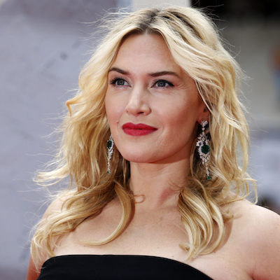 Actress Kate Winslet poses for a photograph as she arrives for the European premiere of "Divergent" at Leicester Square in London