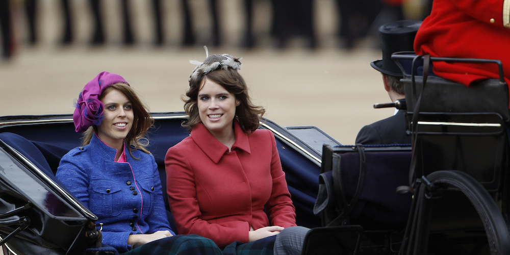 Britain's Princess Beatrice (L) and Princess Eugenie travel to Horse Guards Parade for the Trooping the Colour ceremony in central London June 16, 2012. Trooping the Colour is a ceremony to honour the sovereign's official birthday.    REUTERS/Suzanne Plunkett   (BRITAIN - Tags: ANNIVERSARY ENTERTAINMENT MILITARY SOCIETY ROYALS) - LM1E86G0UHX01